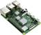 Une carte verte Raspberry Pi avec des ports USB et Ethernet, une connexion HDMI, une puce et un dissipateur thermique.
