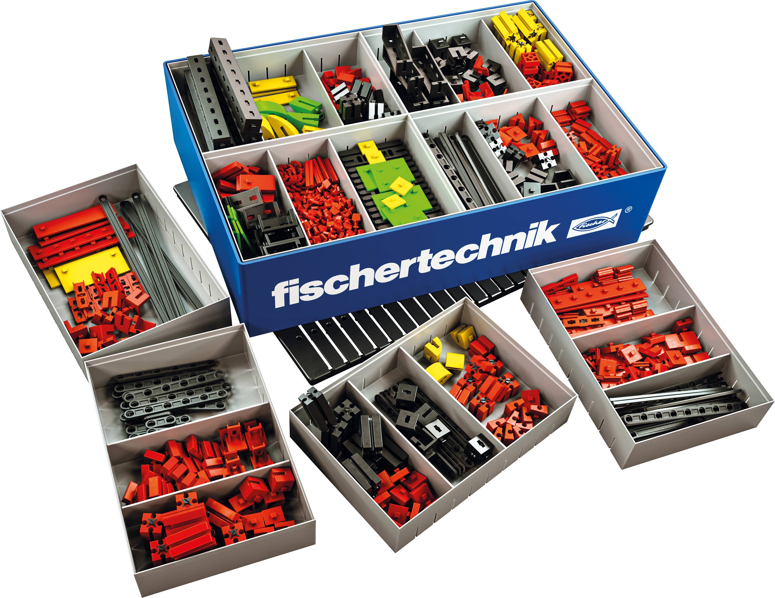 Une boîte de construction Fischertechnik, remplie de différentes pièces colorées et de formes variées, prête pour la construction de modèles.