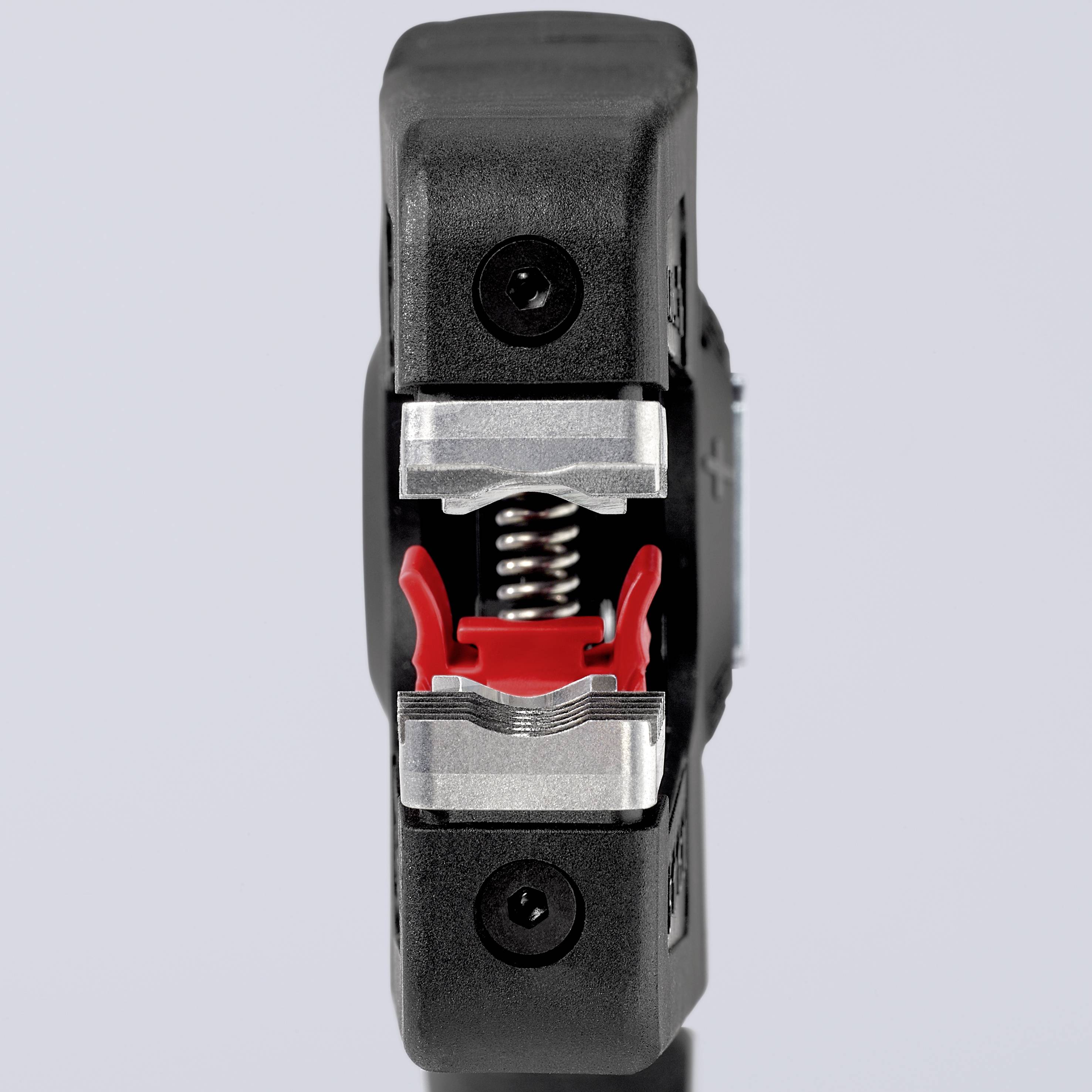 Outil de dénudage de câbles avec mécanisme à ressort, vue de face. Principalement en noir et rouge.