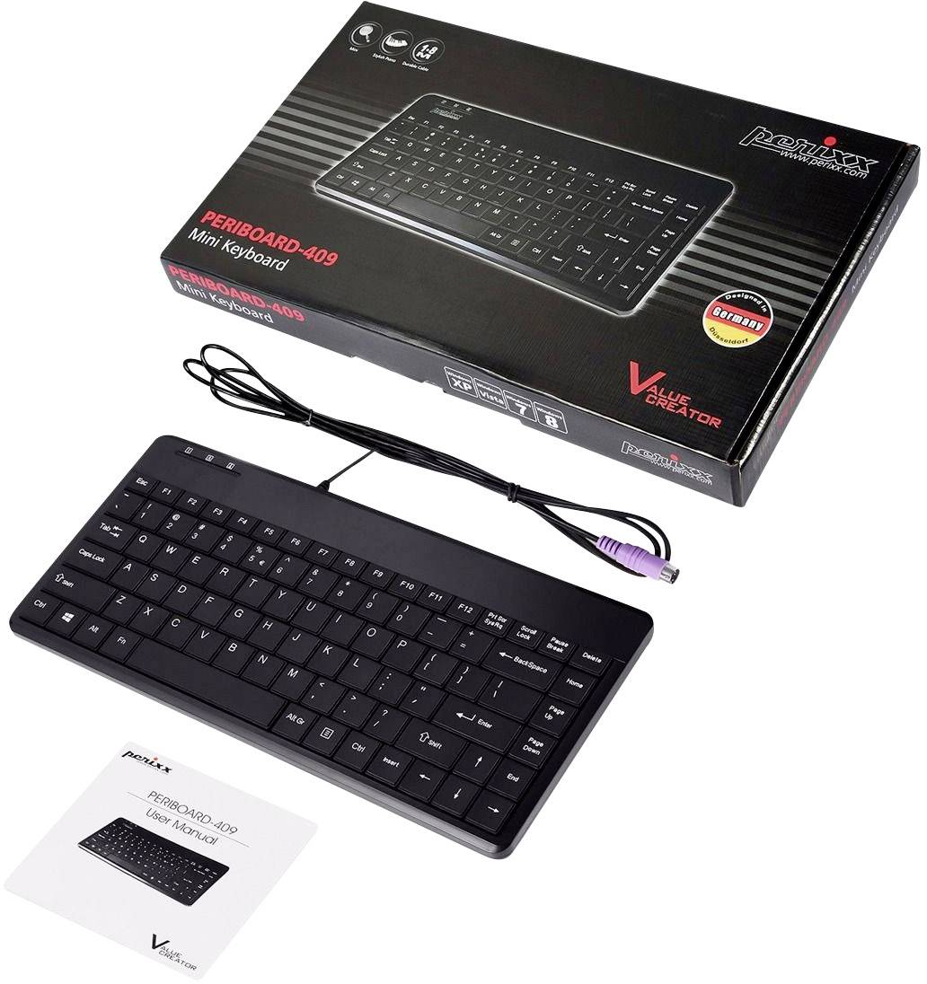 Le clavier Periboard-409 est posé à côté de son emballage et de son mode d'emploi. Petit clavier noir avec connexion USB, adapté pour PC.