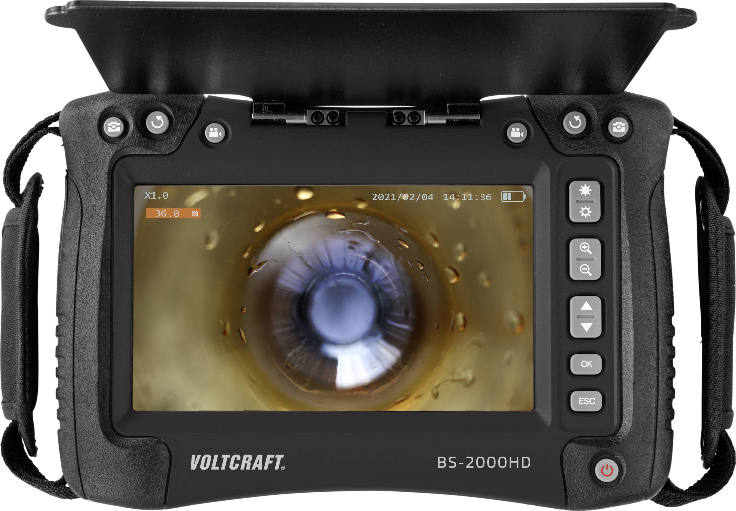Un endoscope affiche sur son écran une image de l'intérieur d'un tube. L'appareil dispose de différentes touches de fonction sur sa face avant.