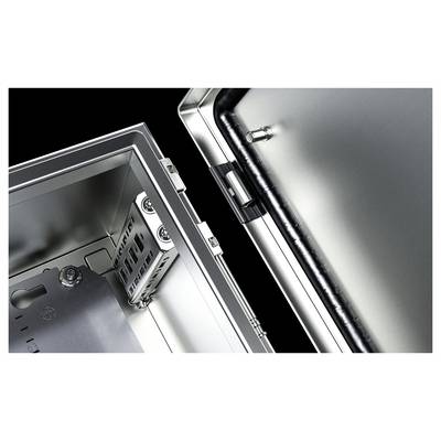 Une armoire électrique ouverte en métal, avec l'intérieur visible. Des vis et des supports pour composants électriques sont reconnaissables.