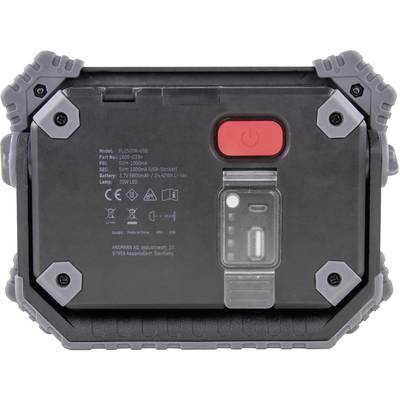 Le dos d'un projecteur à batterie avec un interrupteur marche/arrêt rouge, des spécifications techniques et un port de chargement.