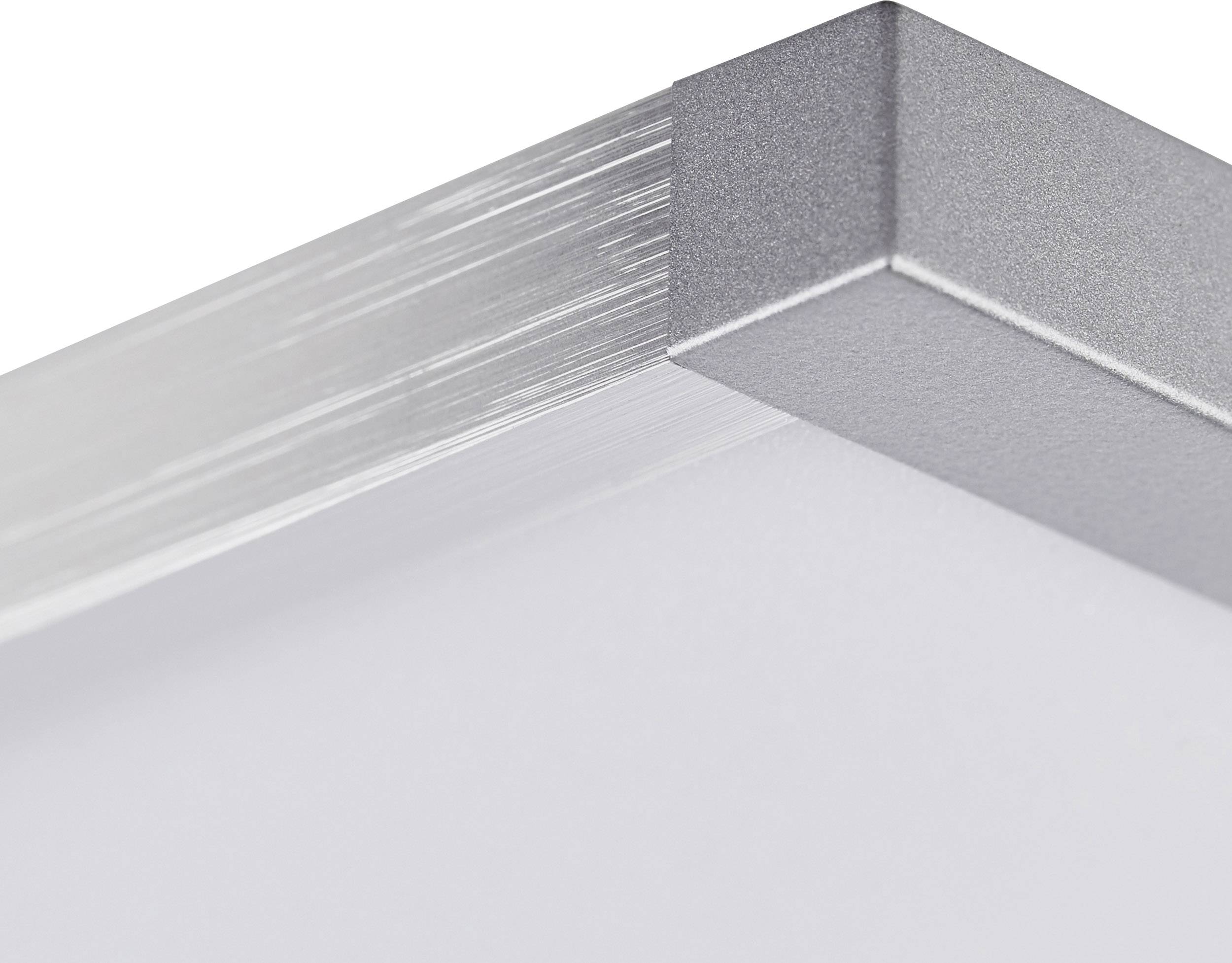 Gros plan sur un cadre métallique argenté formant un angle droit, encadrant un objet simple et blanc.
