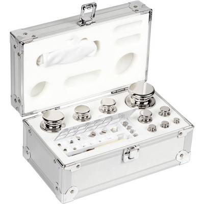 Ensemble de poids composé de différents poids cylindriques en métal, rangés dans un coffret métallique ouvert avec un découpage en mousse pour un rangement sécurisé.
