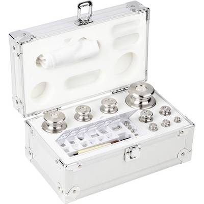 Valise avec des poids de calibrage en métal de différentes tailles, ouverte, montrant des compartiments intérieurs pour un rangement sécurisé.