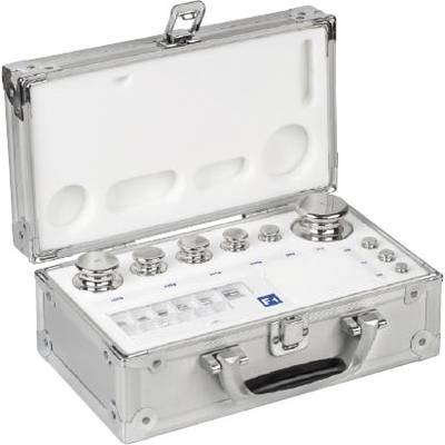 Une boîte métallique ouverte contenant plusieurs pièces de poids cylindriques de différentes tailles, utilisées pour l'étalonnage et la mesure de poids.