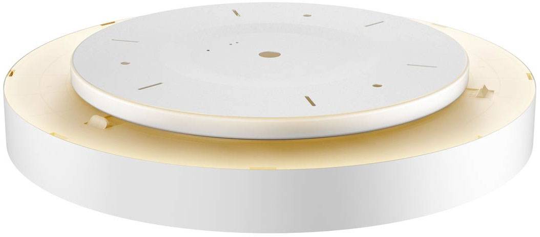 Plafonnier blanc et rond avec éclairage doux et indirect sur les bords. Design moderne et épuré.