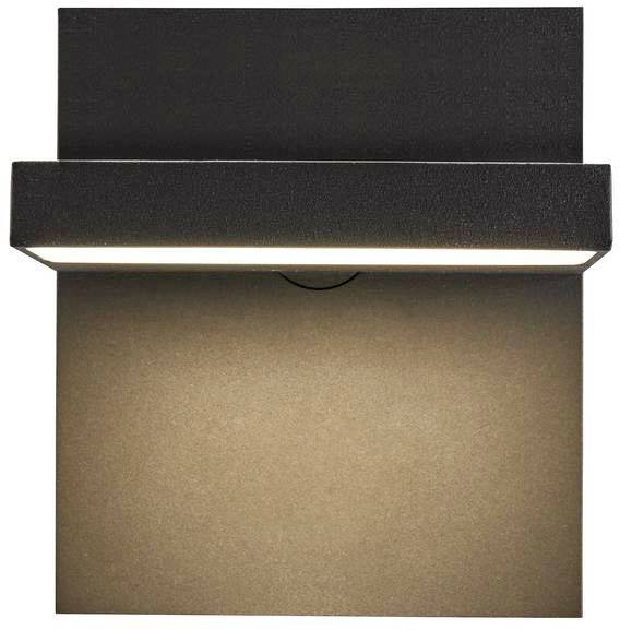 Applique murale moderne avec un boîtier rectangulaire noir. Une fine bande lumineuse éclaire le mur en dessous.