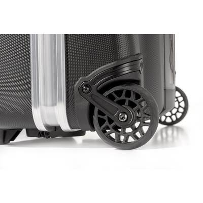 'Gros plan sur deux roulettes robustes en plastique d'une valise de voyage noire sur un fond clair.'