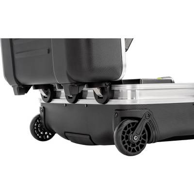 Une valise rigide noire avec des roues robustes et un cadre en aluminium, ouverte et posée sur une surface plane.