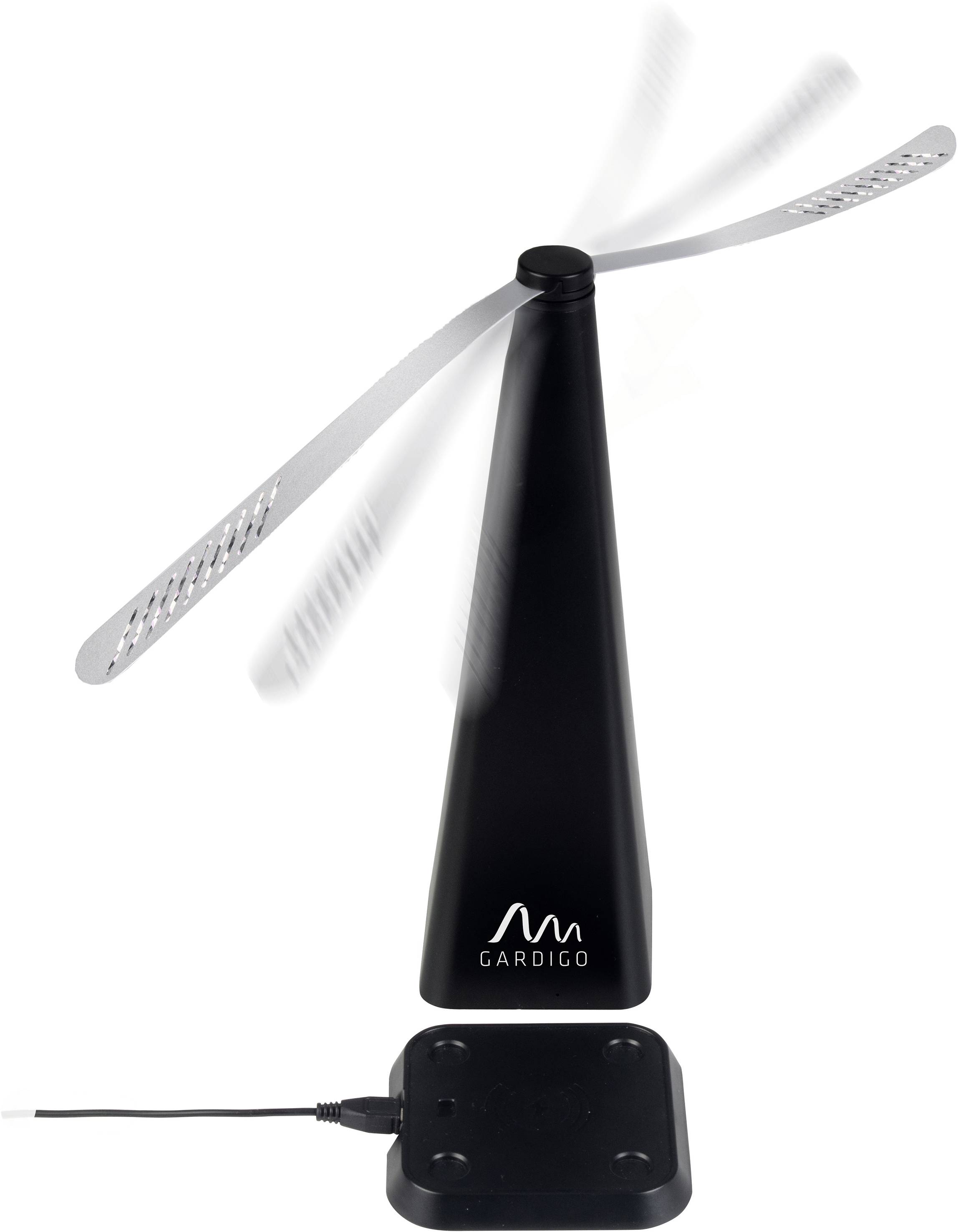 Un dispositif noir anti-mouches avec des tiges rotatives destinées à repousser les insectes. En bas à gauche, une petite station de base avec un câble d'alimentation.