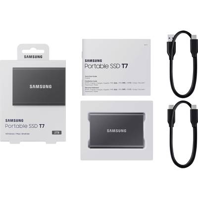 SSD portable Samsung T7 2 To dans son emballage, accompagné de deux câbles USB et du manuel d'utilisation. Compatible avec Windows, Mac et Android.