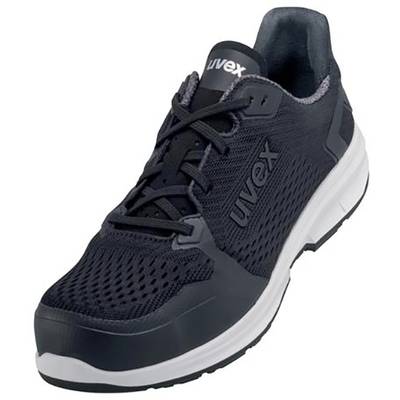 Une chaussure de sport noire avec une semelle blanche et le nom de marque 'Uvex' visible sur le côté.