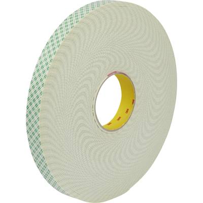 Un rouleau de ruban adhésif double face avec un motif vert à l'extérieur et un intérieur jaune.