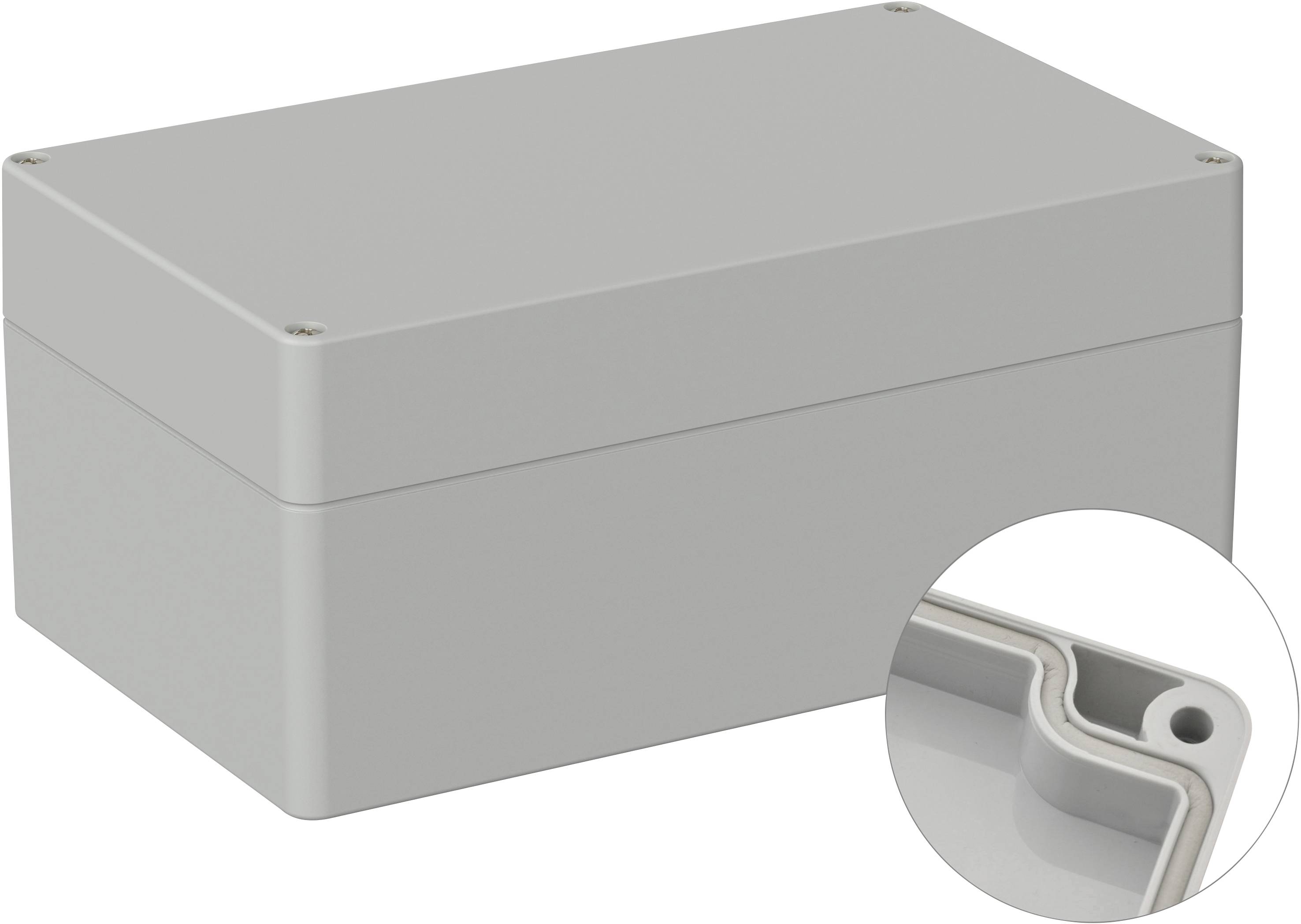 Boîtier en plastique gris, rectangulaire, avec couvercle amovible. Gros plan du bord intérieur arrondi, agrandi en cercle.