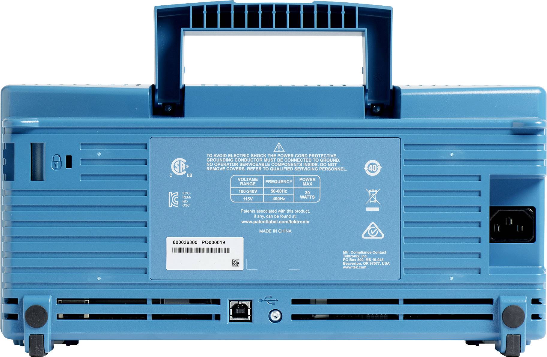 Un appareil audio portable bleu vu de dos, avec des fentes de ventilation visibles, des ports de connexion et une poignée de transport.