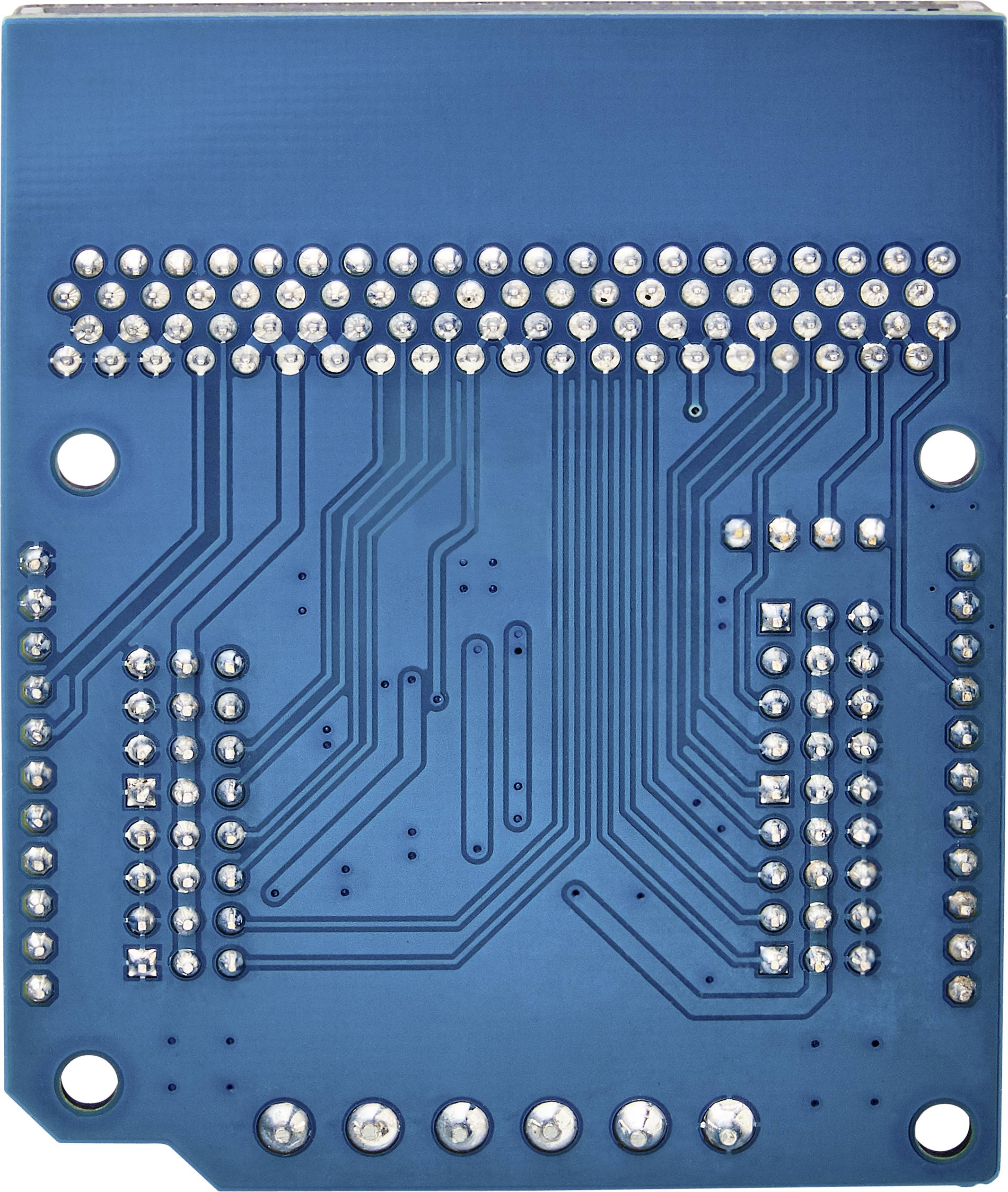 Verso d'un circuit imprimé bleu avec des points de soudure visibles et des pistes conductrices pour les connexions et circuits électroniques.