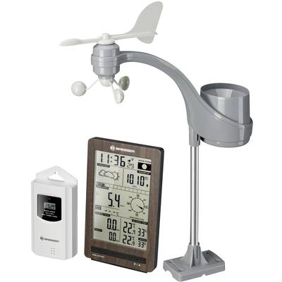 Une station météorologique avec un écran affichant la température, l'humidité de l'air, l'heure et les prévisions météorologiques. Équipée de capteurs de vent et de pluie.