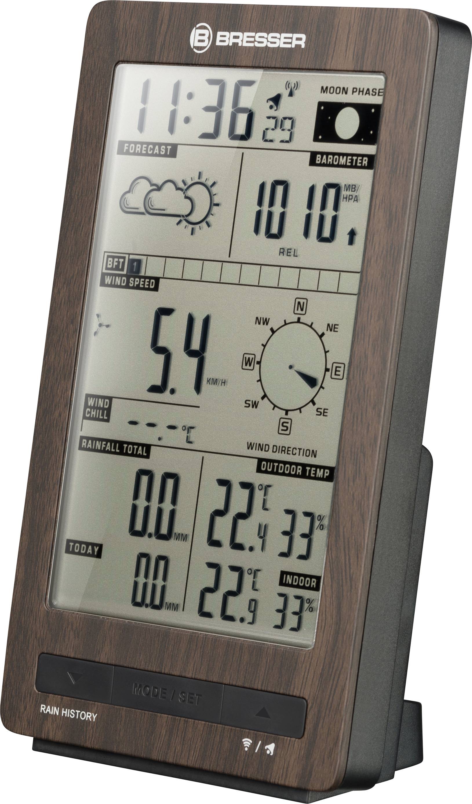 Station météorologique numérique avec affichage de l'heure, des phases lunaires, des prévisions météorologiques, du baromètre, de la vitesse du vent et de la température.