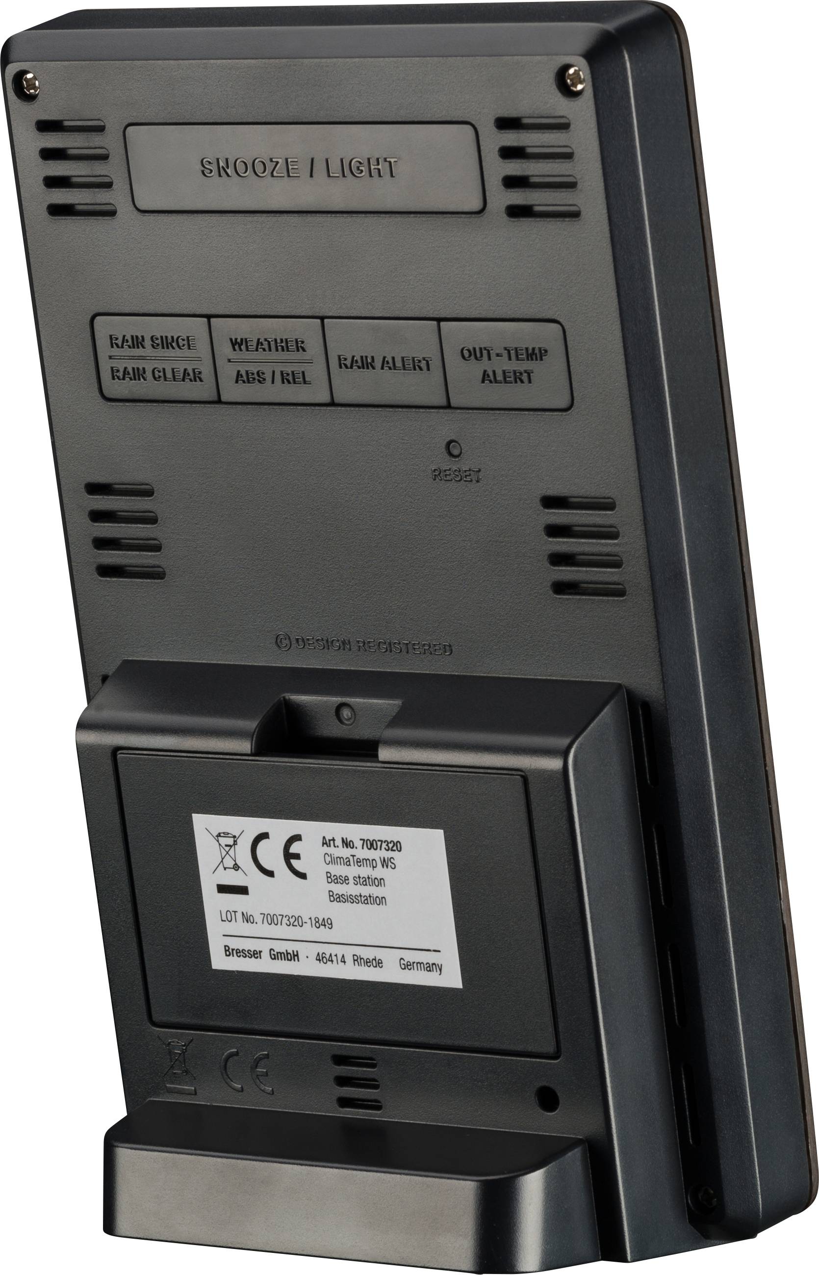 Dos d'un réveil numérique avec différentes touches de fonction et marquage CE. Les informations du fabricant sont visibles.