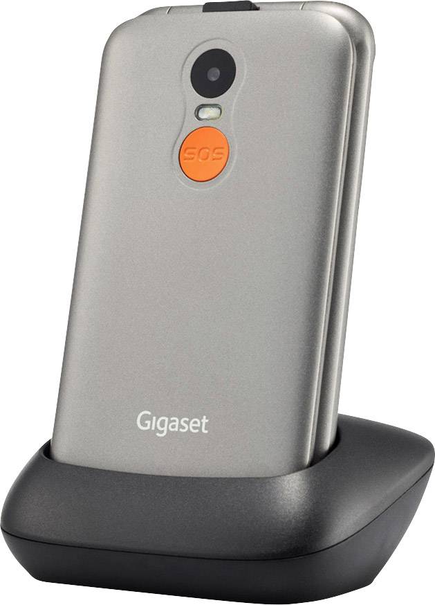 Téléphone portable argenté sur une station de charge noire, avec un bouton SOS orange distinctif à l'arrière.