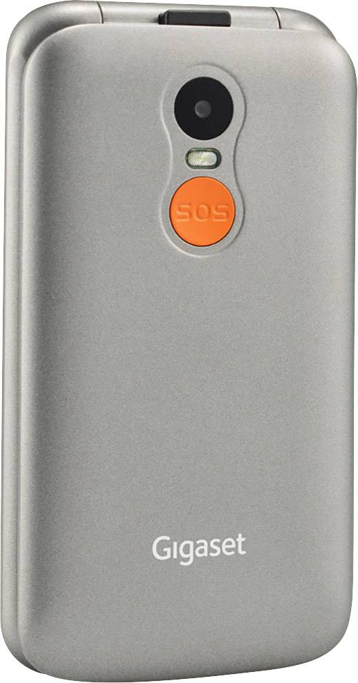 Un téléphone portable à clapet argenté avec une touche 'SOS' à l'arrière. Au-dessus se trouvent un appareil photo et un flash.