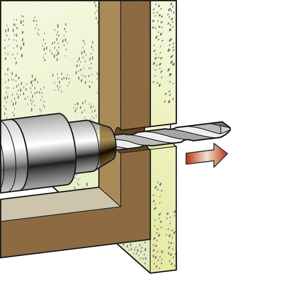 Une perceuse fore un trou à travers un mur. Le foret pointe vers la droite et pénètre le matériau.
