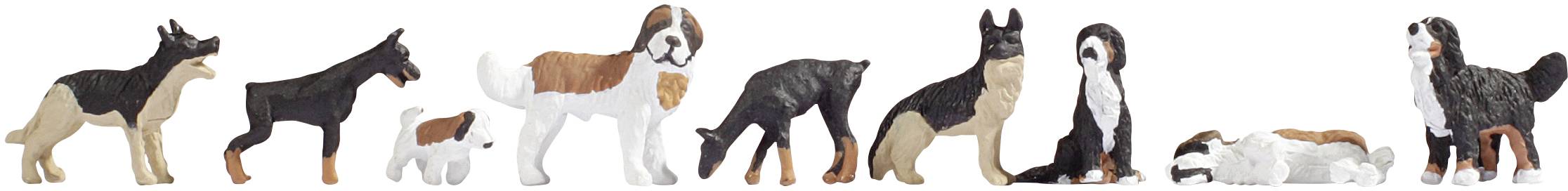 Plusieurs figurines de chiens de différentes races alignées.