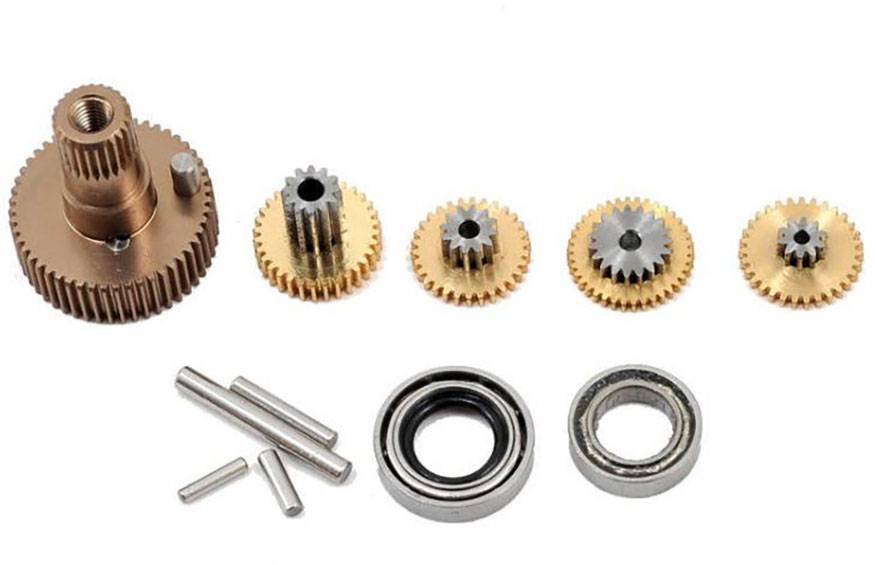 Un ensemble de roues dentées métalliques et de roulements à billes. Les roues dentées présentent des tailles différentes et conviennent à des applications mécaniques.