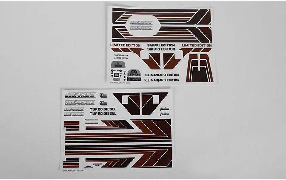 Deux planches d'autocollants avec des bandes brunes et des textes tels que 'Édition Limitée', 'Turbo Diesel', 'Édition Kilimanjaro'. Motifs décoratifs.