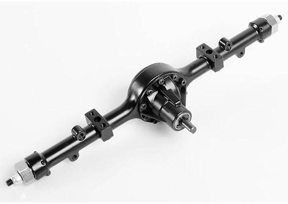 Un axe noir, probablement destiné à un modèle réduit de voiture, avec plusieurs points de fixation et un boîtier de transmission central.