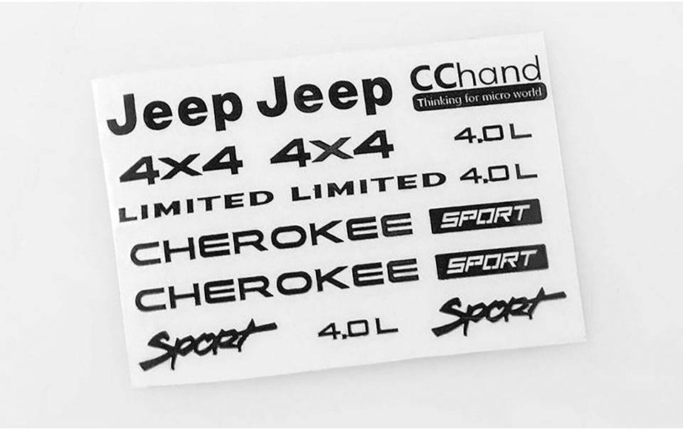 Autocollants blancs avec des inscriptions noires. Comprenant des termes tels que 'Jeep', '4x4', 'LIMITED', 'CHEROKEE', et 'SPORT'.