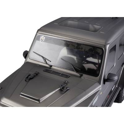 Une voiture miniature noire au design anguleux, vue de dessus. Le véhicule possède des essuie-glaces noirs et un emblème sur le pare-brise.