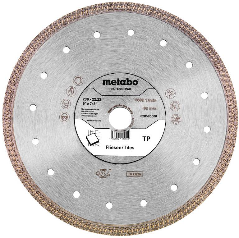 Lame de scie circulaire diamantée Metabo Professional étiquetée « Fliesen/Tiles », 230 mm, avec un trou d'arbore central et des segments de tranchant pour la coupe de carrelage.