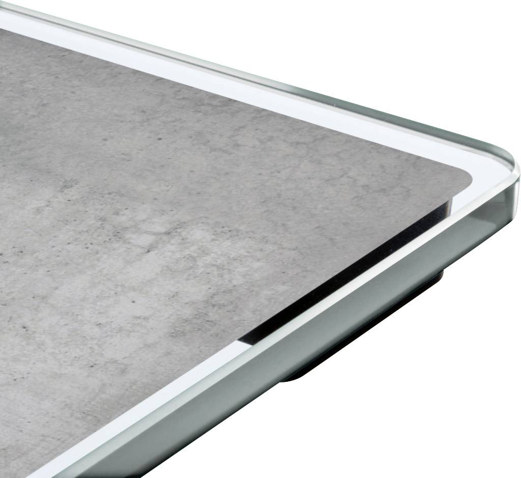 Une table blanche avec une surface grise ressemblant à du béton.