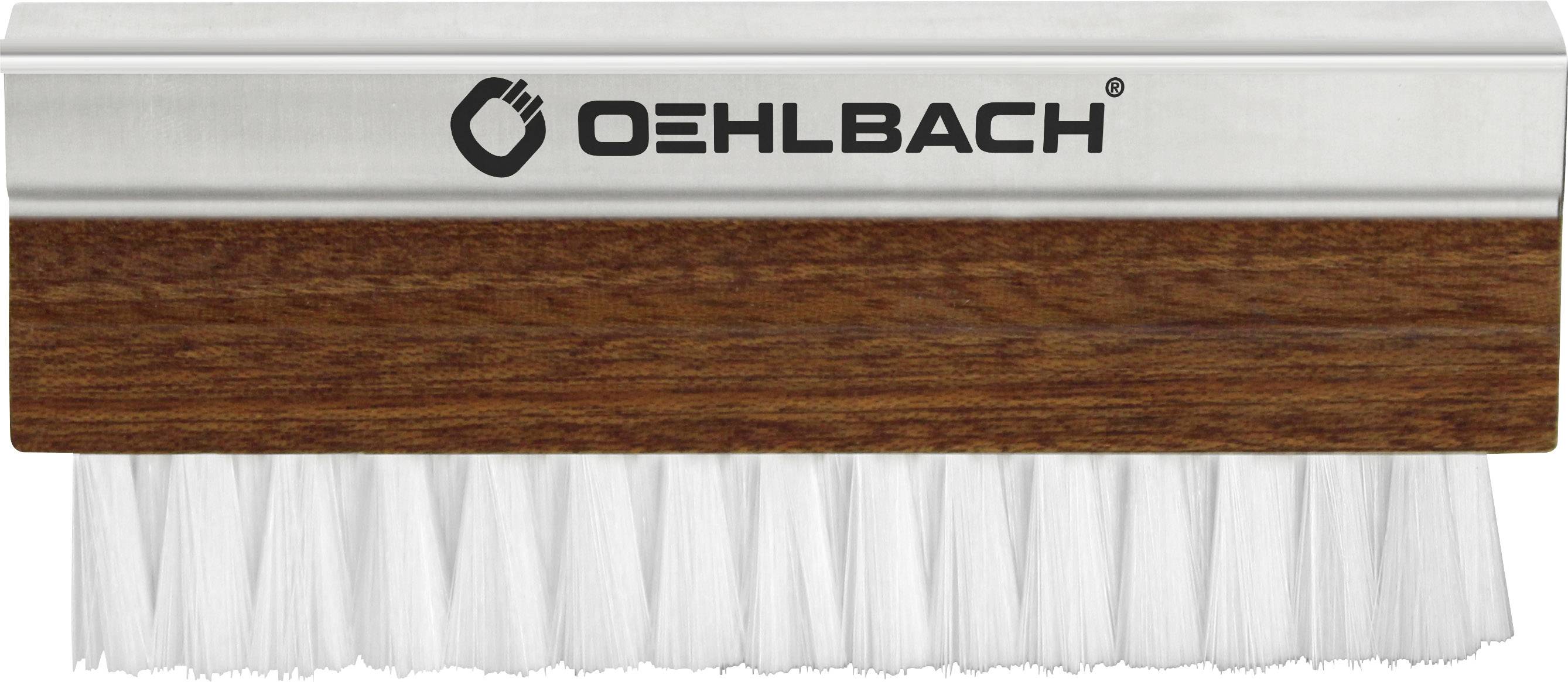 'Brosse avec manche en bois brun et poils blancs, nom de marque Oehlbach sur un ruban argenté au-dessus des poils.'