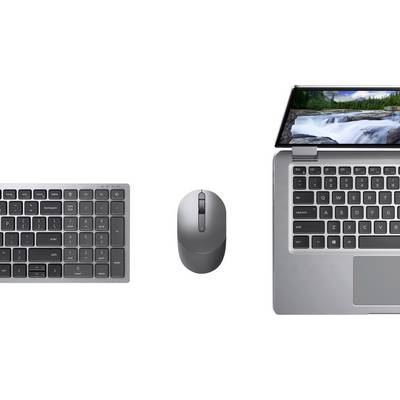 Clavier, souris et ordinateur portable vus de dessus. L'écran de l'ordinateur portable affiche une cascade.