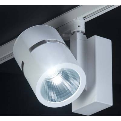Un projecteur de plafond moderne argenté brille intensément. Il est monté sur un rail et utilisé dans une pièce sombre.