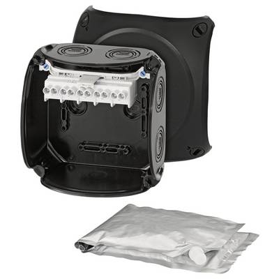 Une boîte de connexion noire avec un couvercle ouvert montre les connexions de câblage intérieures. En dessous se trouve un jeu de joints argentés.