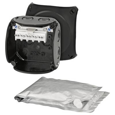 Boîte de jonction noire ouverte avec des bornes de câblage, avec un sachet de scellement argenté en dessous.