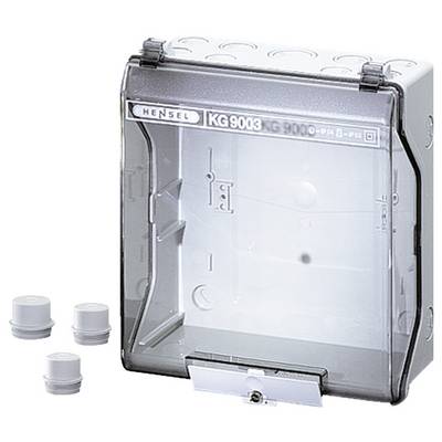 Boîtier de distribution transparent Hensel KG 9003 avec couvercle, adapté pour montage mural. À côté, trois capuchons de fermeture ronds gris.