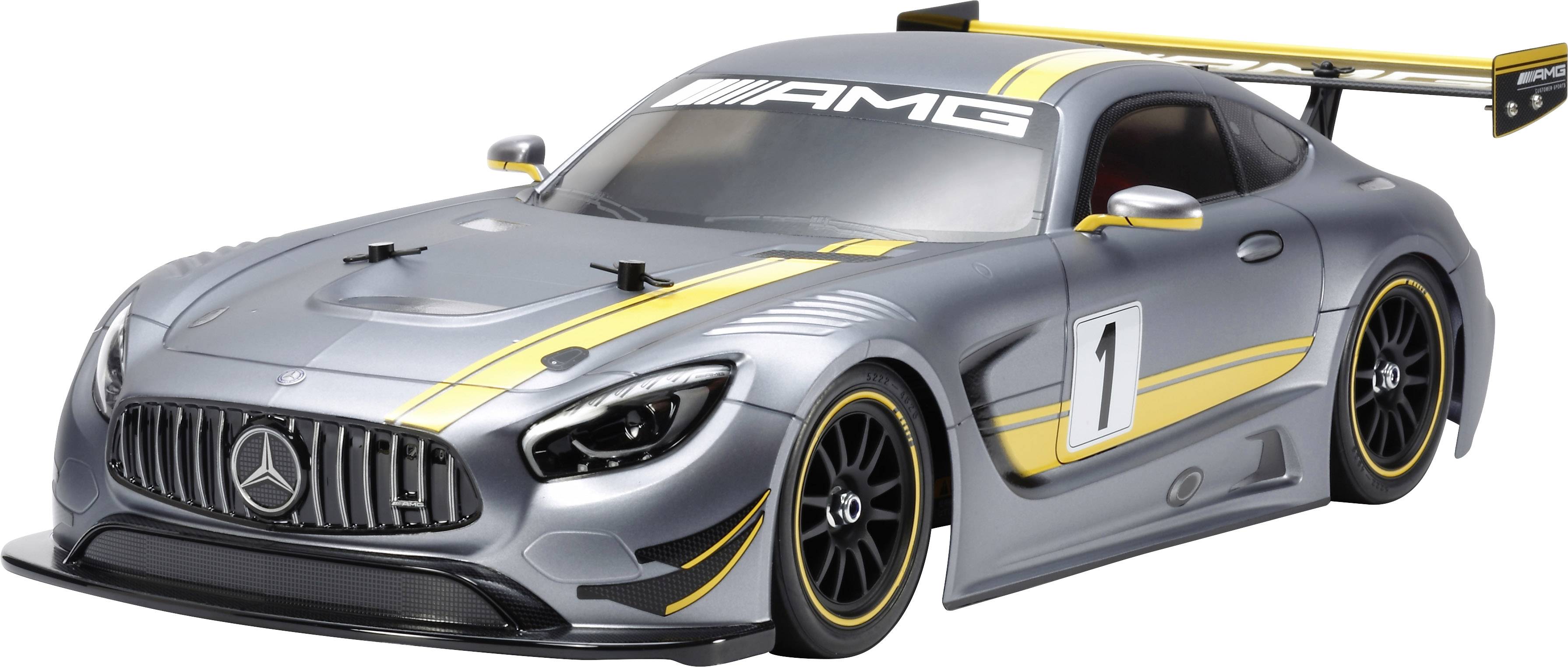Voiture miniature grise d'une voiture de sport avec logo AMG, numéro '1', bandes jaunes et grand aileron arrière.