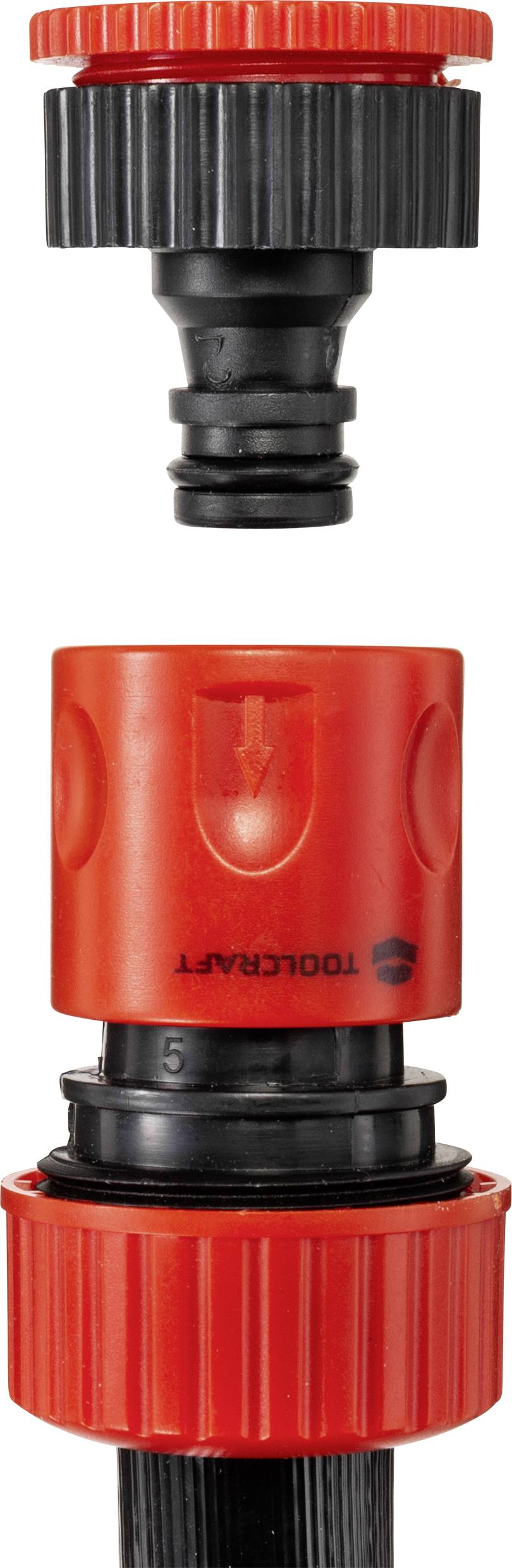 Système de couplage de tuyau d'arrosage, composé d'une pièce de connexion noire et rouge qui relie des conduites d'eau.