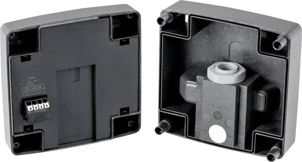 Boîtier noir ouvert avec barrette de connexion et presse-étoupe, adapté pour un montage mural.