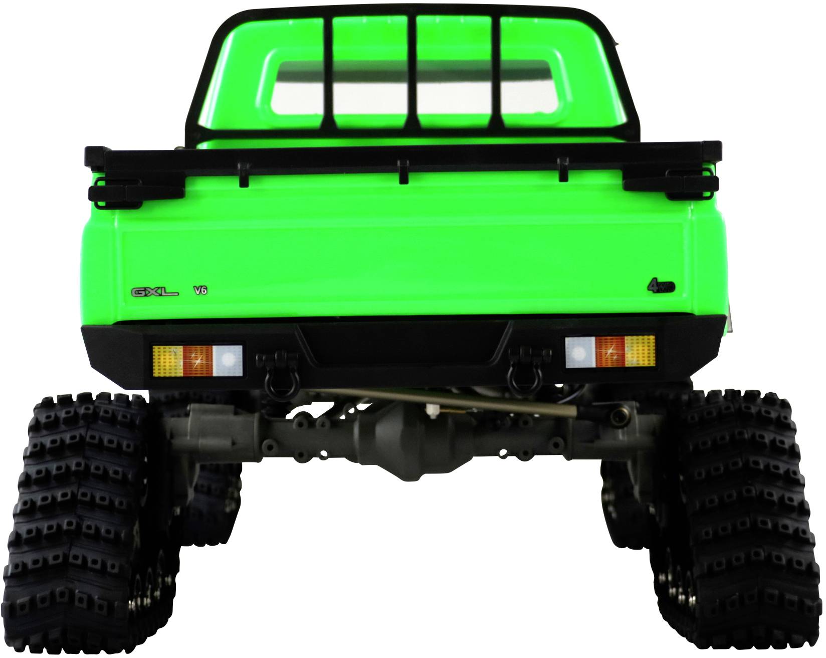 Camion de jouet vert vu de dos, avec de grandes roues rugueuses et l'arrière de la benne de chargement bien visible.