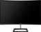 Un moniteur d'ordinateur moderne, incurvé, avec un cadre noir, est posé sur un socle rectangulaire simple.