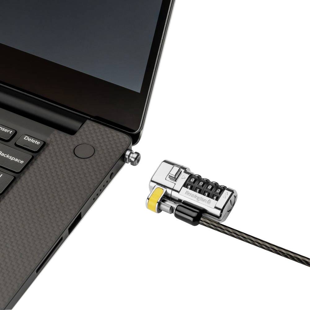 Un ordinateur portable est attaché à un câble de sécurité avec un verrou à code pour prévenir le vol. Le câble est sécurisé sur le côté de l'ordinateur portable.