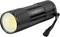 Lampe torche noire avec structure texturée, lumière jaune de projecteur et dragonne à l'arrière.