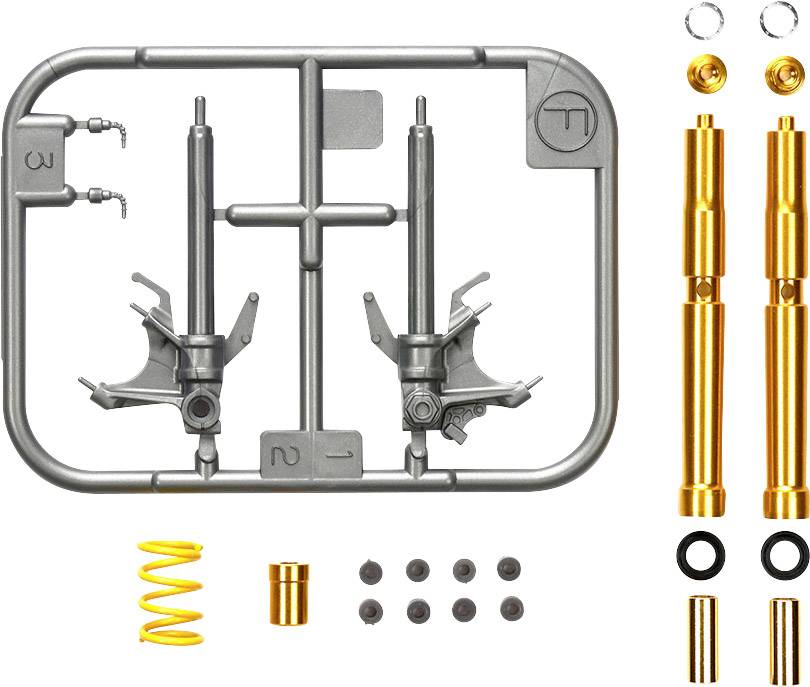Kit de construction avec des pièces métalliques et des vis, principalement en tons d'argent et d'or. Contient des ressorts et de petits composants ronds.